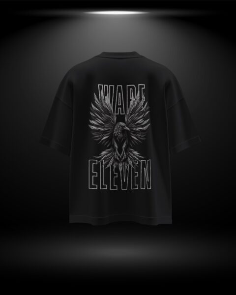 Black t-shirt with a winged logo and text on the back against a dark background