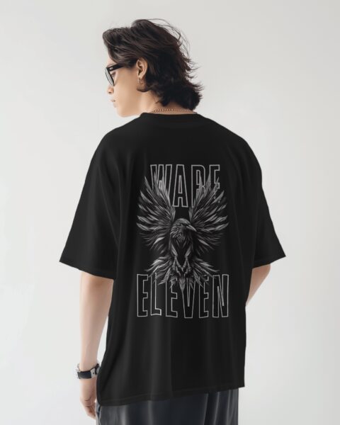 Person wearing a black t-shirt with 'Ward Eleven' design on the back, standing against a plain background.