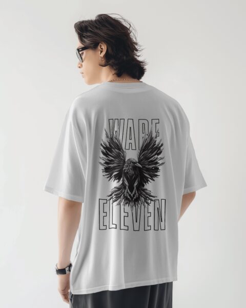 Person wearing a white t-shirt with a black eagle design and text on the back, on a plain background.