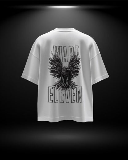 White t-shirt with black eagle design and 'Warp Eleven' text on a dark background