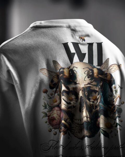 White shirt with a skull and floral design on a dark background